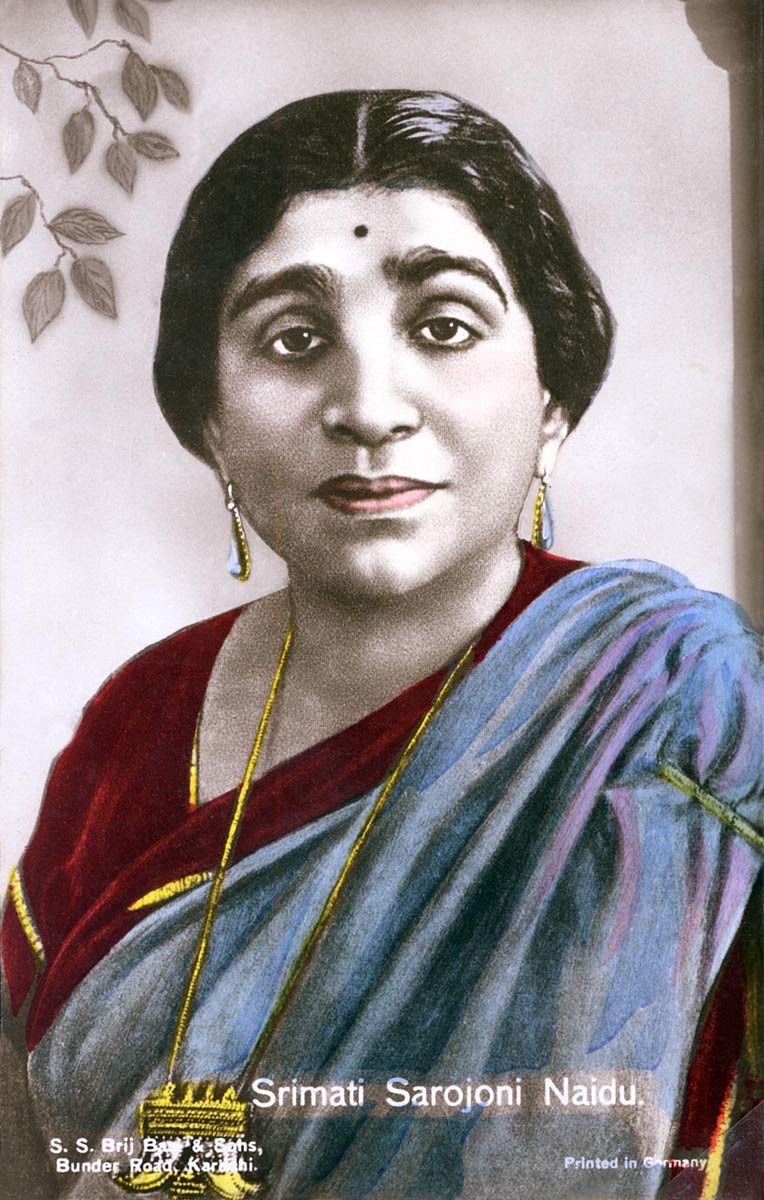 Hand-coloured printed portrait card of Sarojini Naidu in a crimson and blue-grey sari.